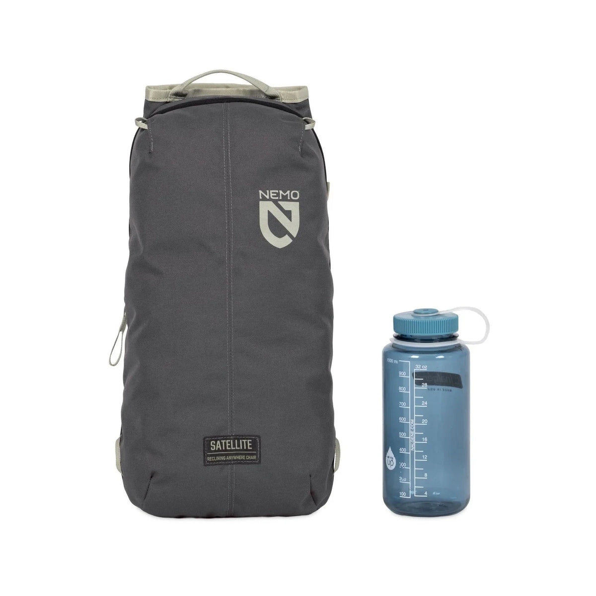 NEMO Satellite reclining chair in dark grey carry bag, packed, standing beside a blue water bottle
