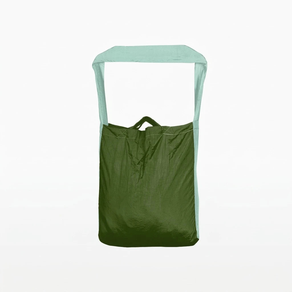 Ticket to the Moon Lightweight Foldable Eco Bag Medium in leaf green and mint, standing upright with pale green strap