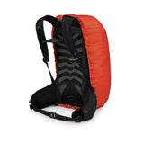 Osprey Hi-Vis backpack raincover in orange-red, shown from the back fitted over a black pack to show how it sits