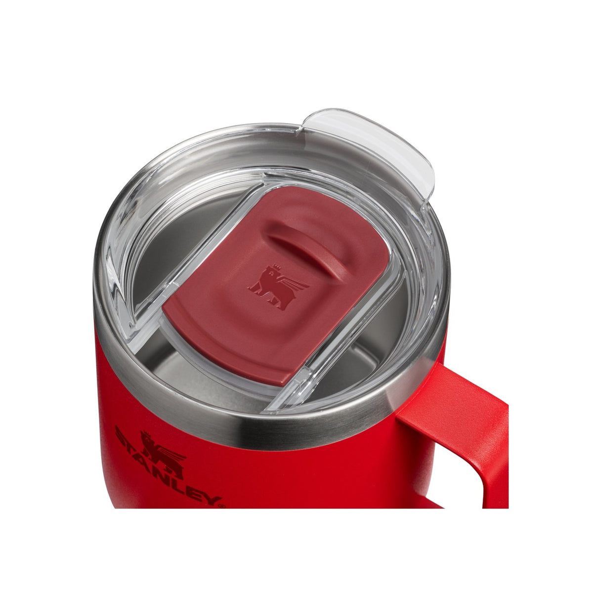 Stanley Everyday camp mug in red with a clear lid and red sliding cover, viewed from above and cropped at the edges
