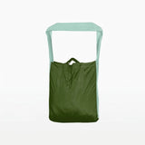 Ticket to the Moon Lightweight Foldable Eco Bag Medium in leaf green and mint, standing upright with pale green strap