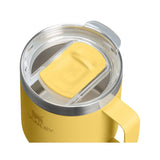 Stanley Everyday camp mug in yellow with clear sliding lid, seen from above at an angle