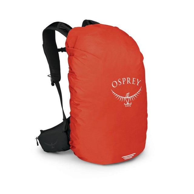 Osprey Hi-Vis backpack raincover in red, size S, fitted over a backpack